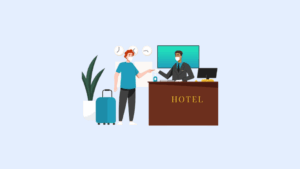Hotel front desk staff assisting a guest during check in using a property management system